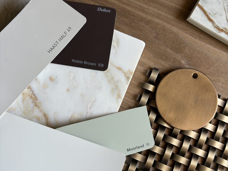 Kitchen sample board mood board with antique brass mesh walnut veneer and copper tapware